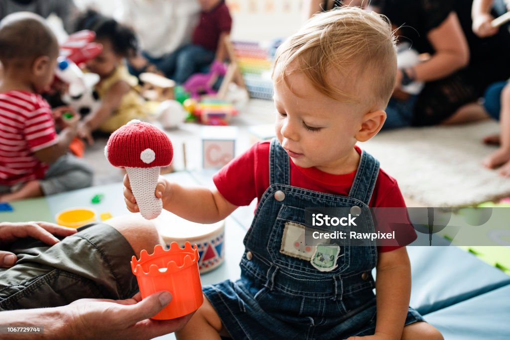 Cute little boy playing with toys at the learning center